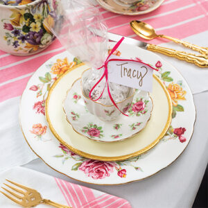 Pink, white and gold table place setting featured in TeaTime March April 2022