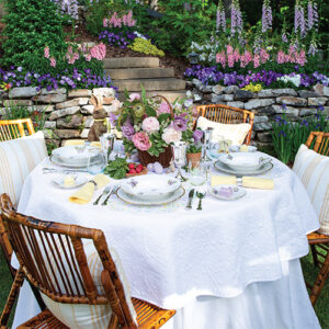 Southern Lady March-April 2022 Table In Garden With Floral Table Spead And White Table Cloth