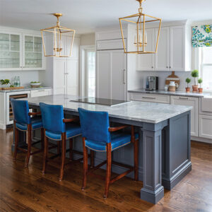 The Cottage Journal Spring 2022 White and Grey Kitchen Island With Blue Chairs