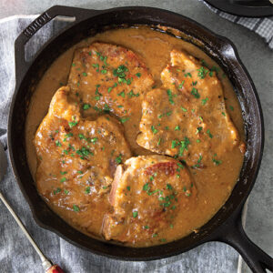 Smothered Pork Chops Featured In Louisiana Cookin' May/June 2022