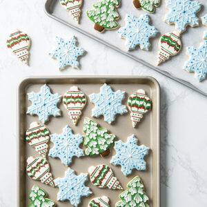 iced holiday cookies on sheet pan