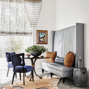 non-formal dining brown table and chairs with grey sofa
