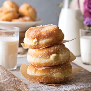 stacked donuts with glass of milk