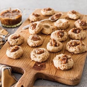 thumbprint cookies on wooden board