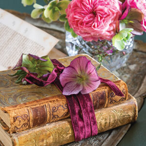 two books tied with ribbon and flowers