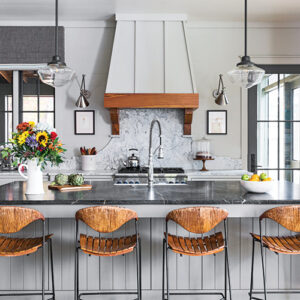 white and wood accent kitchen with black counter tops