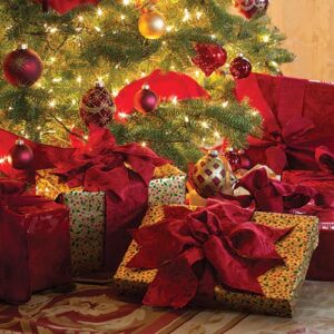 Red ribbon wrapped presents under christmas tree