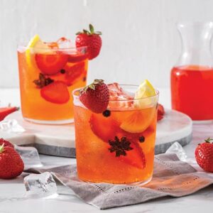 Strawberry and fruit drink in a glass cup