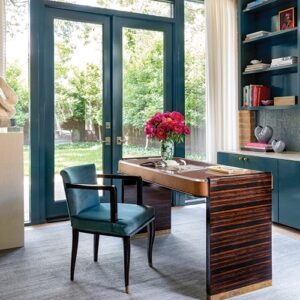 formal office with dark walls and wood tones