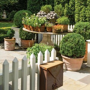 Outdoor garden with white picket fence