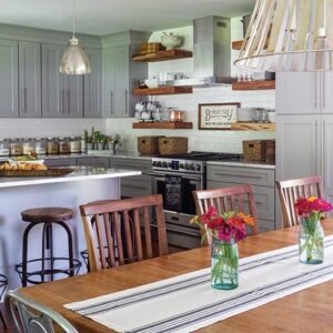 grey and wooden kitchen with island and dining table