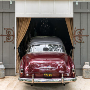 Vintage car in car port