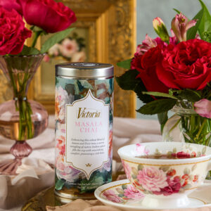 Styled masala chai with roses and tea cup