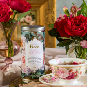 Styled orange almond tea with roses and tea cup