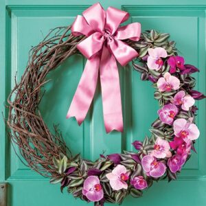 Pink floral wreath on teal door