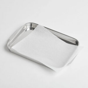 Parchment paper sheet on silver sheet pan