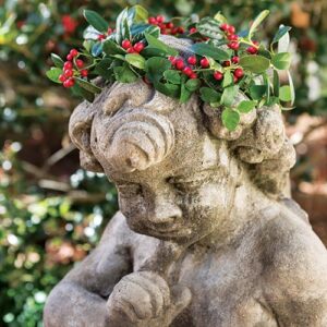 Garden statue with wreath