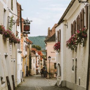 Bake from Scratch May_June 2025 European street scene with cobblestones