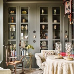 Inviting Southern Home Interior Design with muted grey and green sitting room bookcase