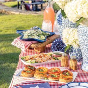 Southern Lady July/ August Issue featuring patriotic spread of food on party table outdoors.