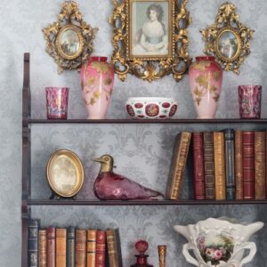 Victoria July/ August Issue featuring open shelving with antique books and decor