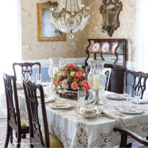 Victoria July/ August Issue featuring dining tables set with china