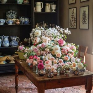 Victoria July/ August Issue featuring bouquet of roses on table