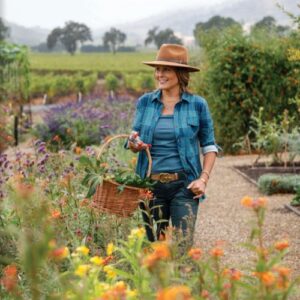 Victoria Autumn Bliss Girl in field of flowers with basket