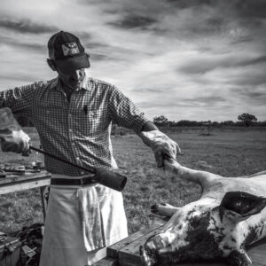 Black and white chef with pig roast