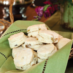 Scones in basket with green linen
