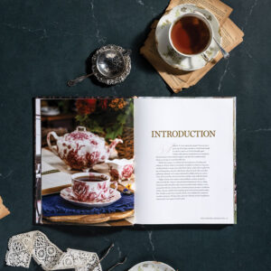 Comfort of Books and Tea internal spread with tea and ribbon on dark background