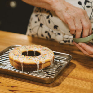 Sprinkling sprinkles on a dessert