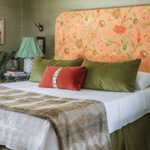 Bed with orange floral headboard