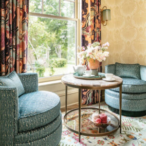 Sitting area with blue chairs and round table