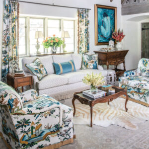Sitting room with floral arm chairs and white couch