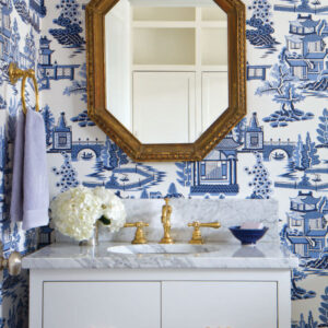 Sink with blue and white wallpaper