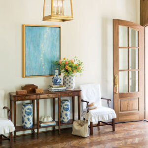 Entry way with side table and blue picture