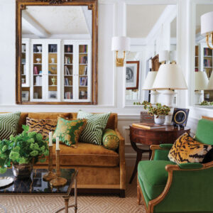 Living area with green chairs and brown accents
