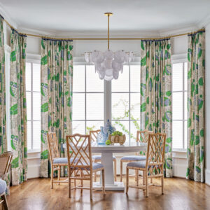 Living room with large windows and green curtains