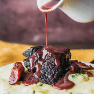 Braised short ribs with red wine sauce over potatoes