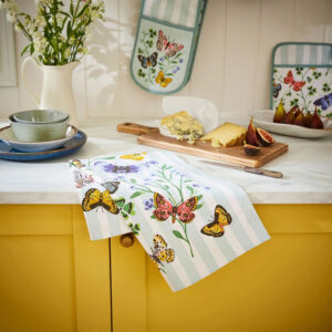 Butterfly tea towel with blue stripe and pink, purple butterflies and green leaves