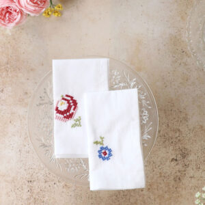 Hand stitch napkin with blue and pink stitch