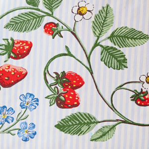 Tea cosy with green vine, blue flowers, and strawberries
