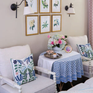 White chairs with blue pillows and table