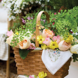Flower basket with yellow and pink flowers
