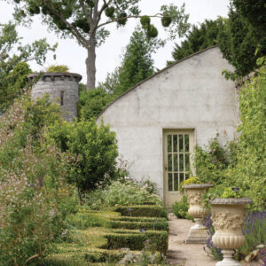 Stone cottage surrounded by greenery