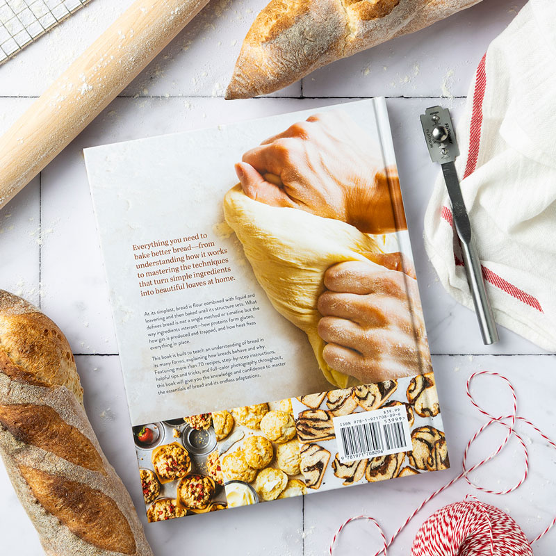 Bread Baker's Companion Back Cover with bread loaves, red string, and rolling pin