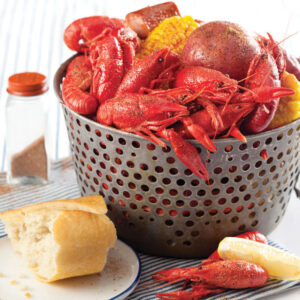 Crawfish in basket with lemon, corn, and bread