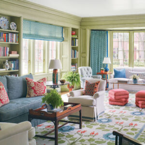 Living room with pink accents and blue curtains