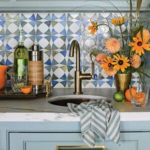 Sink with orange flowers and backsplash